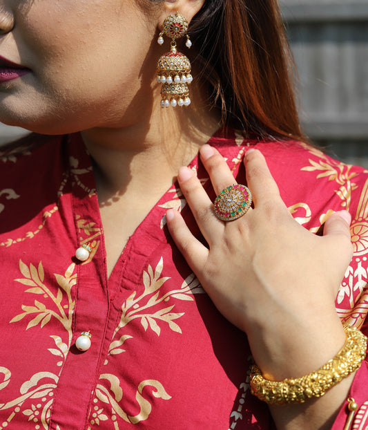 American diamond ring studded with semi precious red and green stones